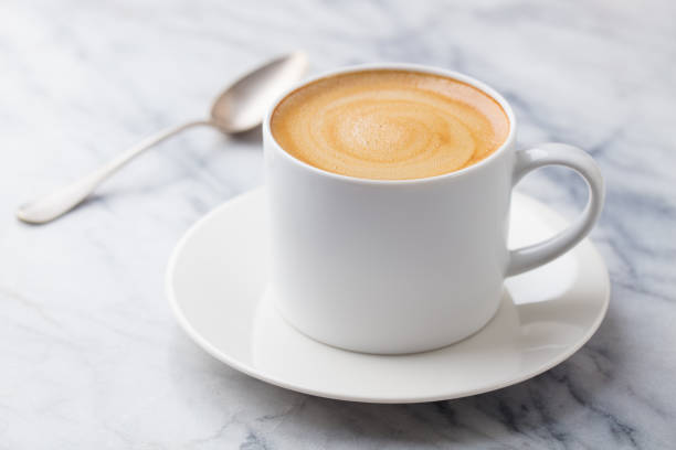 istock Coffee, espresso in white cup. Marble background. Close up. 1276911420