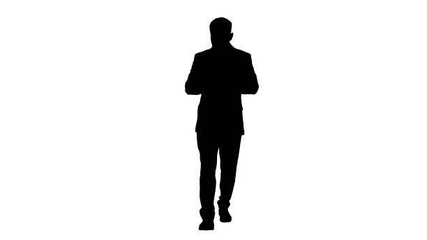 istock Businessman walking and using the phone, Alpha Channel 1276913325