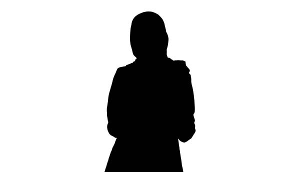 istock Silhouette Smiling arab woman using smart phone 1276913459