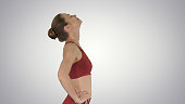 Female walking and doing neck stretching exercise to release bui