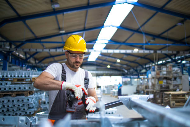 istock Factory worker assembling meal parts for automobile industry. 1276917659