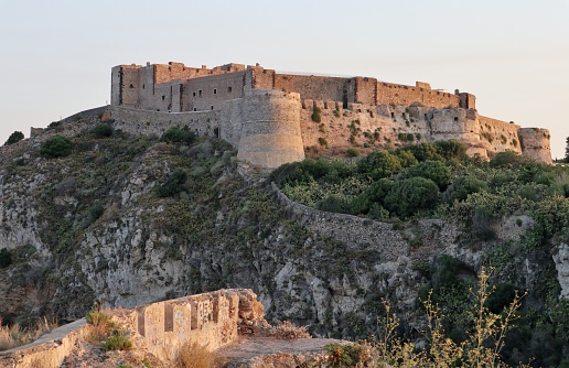 Milazzo, Sicily, Italy - August 30, 2020: Fortified citadel enclosed by Spanish walls at dawn
