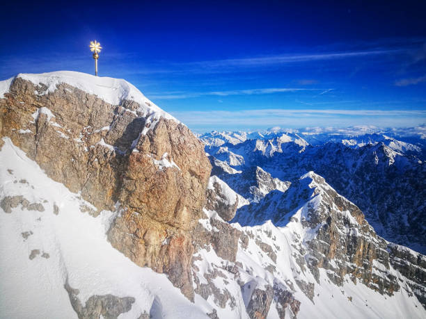 Top of Zugspitze, Germany Gipfelkreuz on Germany's highest mountain, Zugspitze zugspitze mountain stock pictures, royalty-free photos & images