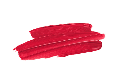 Marca de lápiz labial rojo sobre un fondo blanco aislado. Frotis de brillo labial. Productos para el maquillaje y el cuidado de la piel. Cosméticos de belleza. Cosmetología. Closeup. photo