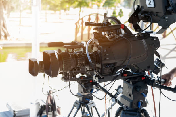 istock The cameraman is on duty and two camera lenses for broadcast are focused on the program guests 1276924934