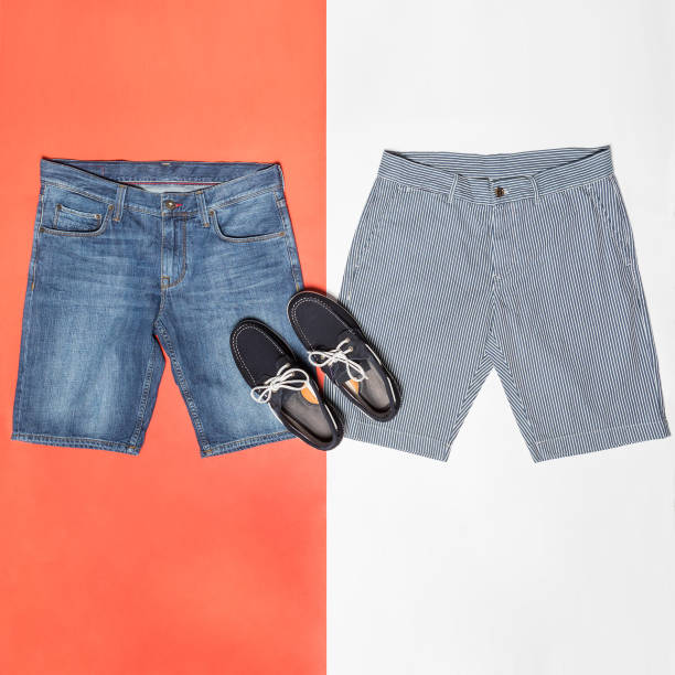 istock Man jeans shorts with a black shoes 1276930601