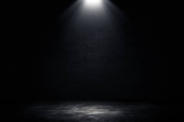 istock Studio dark room concrete floor grunge texture background with spotlight. 1276932115