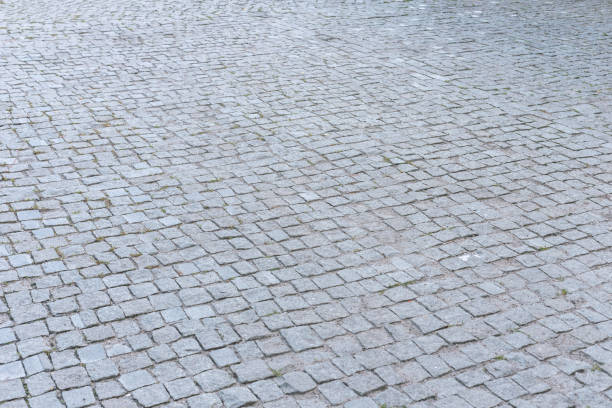 istock Perspective view of the stone paving stones, background. 1276932711