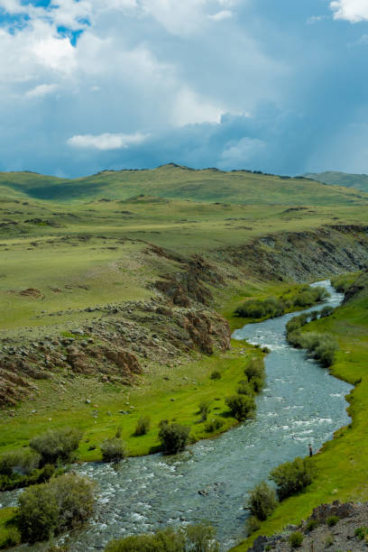 istock River flowing through a mountain valley, Altai Mountains, Siberia 1276936939