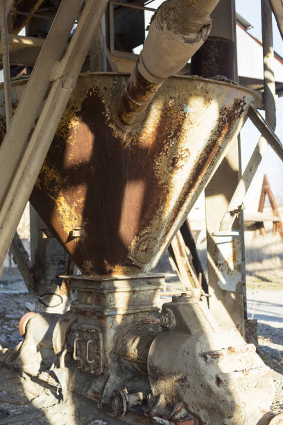 istock Old, abandoned concrete plant with iron rusty tanks and metal structures. The crisis, the fall of the economy, stop production capacity led to the collapse. Global catastrophe. 1276944005