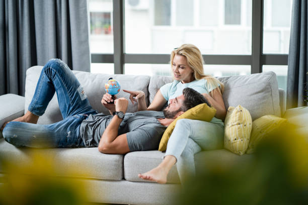 Happy young couple planning their new trip.