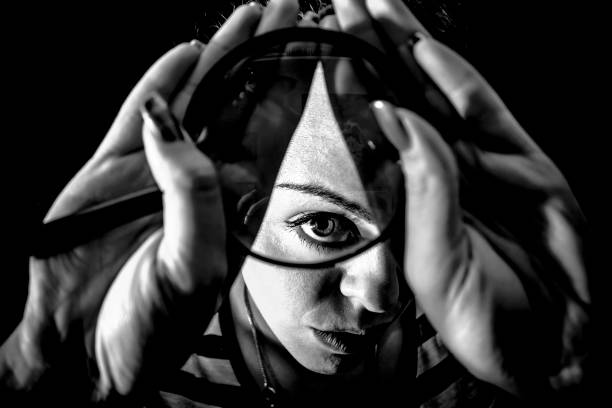 Girl with a magnifying glass, black and white image, rare composition