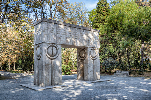 Targu-Jiu, Romania-september 25: Constantin Brancusi's Kissing Gate  on September 25, 2020 in Targu Jiu. The sculpture is part of the Sculptural Ensemble of Constantin Brancusi at Targu Jiu.