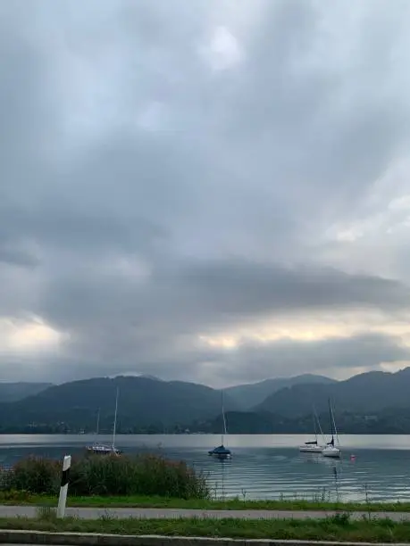 Cloudy sky shortly before sunset and storm, Wiesseer Mountains, 4 boats, Tegernsee, Upper Bavaria