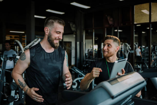 istock Indoor personal cardio training in gym 1276949810