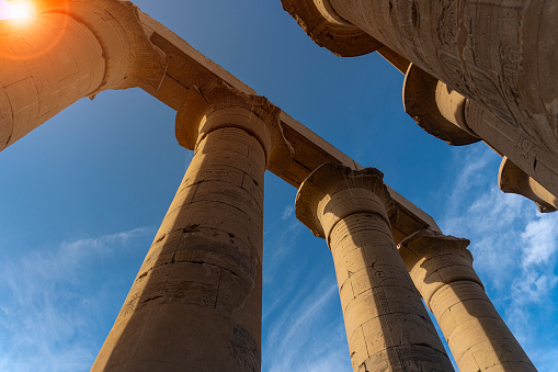 Woman tourist at Luxor Temple in a sunny day, Luxor, Egypt