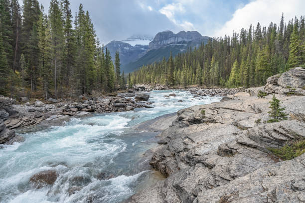 istock Mistaya River with Mount Sarbach and Ep 1276952048