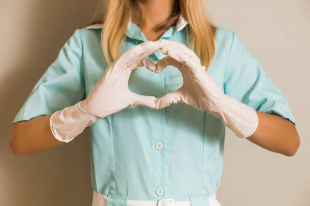 istock Nurse showing heart shape with hands 1276955801
