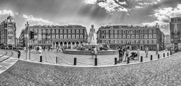 NICE, FRANCE - AUGUST 11: Panoramic view of Place Massena, Nice, Cote d'Azur, France, on August 11, 2019. It's the main square of the city, with many historic buildings and the Fontaine du Soleil
