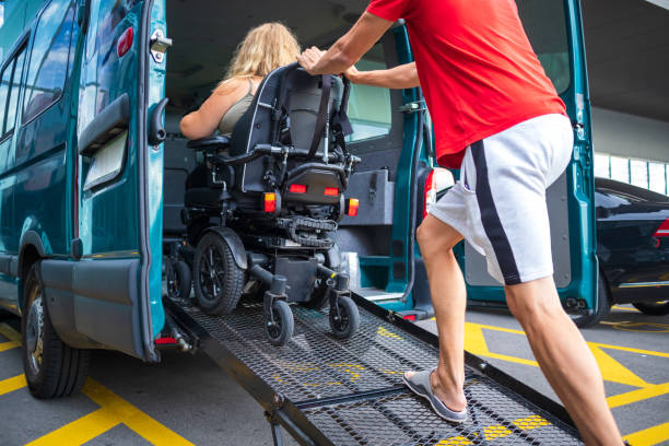 istock Disabled person on wheelchair using van ramp 1276959243
