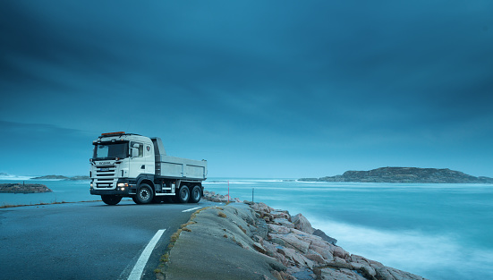 Lindesnes, Norway - december 24 2013: Scania R480 parked by the sea in the evening.