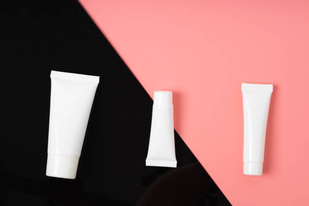 istock white realistic glossy cosmetic tubes on back and pink 1276959599