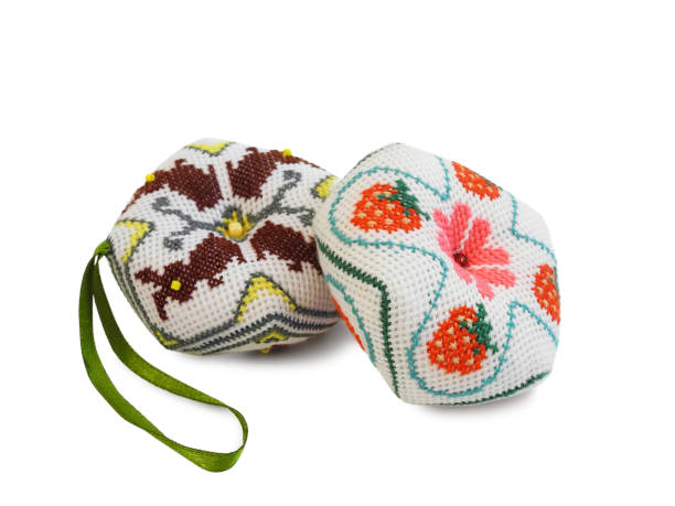 istock Handmade pincushions cross-stitch embroidered isolated 1276962493