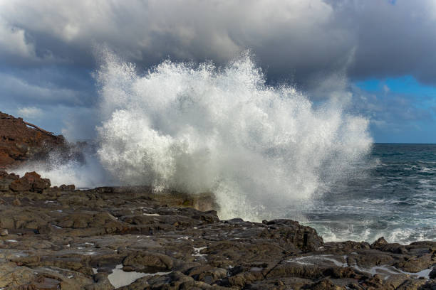 istock Big waves on the rocky coast. Hawaii 1276963950