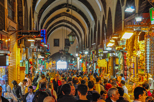 A large group of people walking inside the Grand Bazaar at Istanbul city, Turkey.