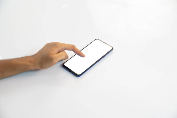 istock hand holding a smartphone in white background 1276965097