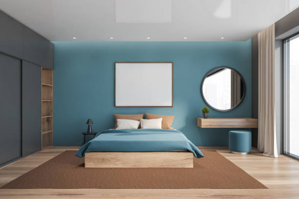 istock Blue bedroom interior with mirror and poster 1276968496