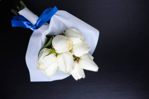 istock bouquet of white roses 1276970077
