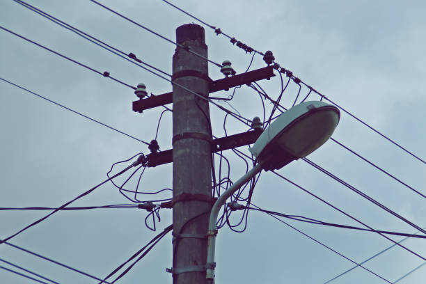 istock Weathered streetlight and pole on a cloudy day. 1276977086
