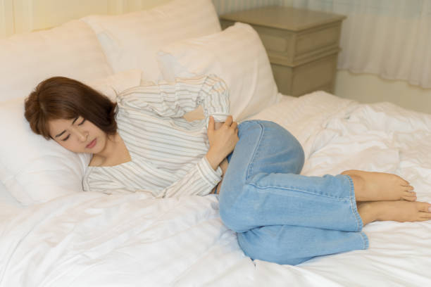 istock Young Asian women have severe stomachache 1276978219