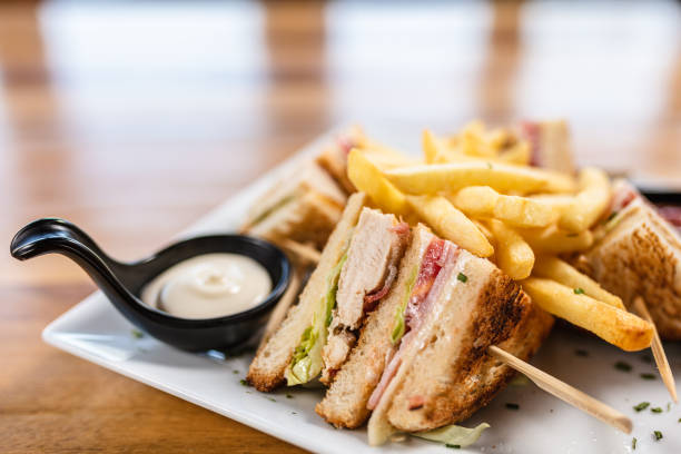 Delicious club sandwich Delicious club sandwich served with french fries sandwich club sandwich lunch restaurant stock pictures, royalty-free photos & images