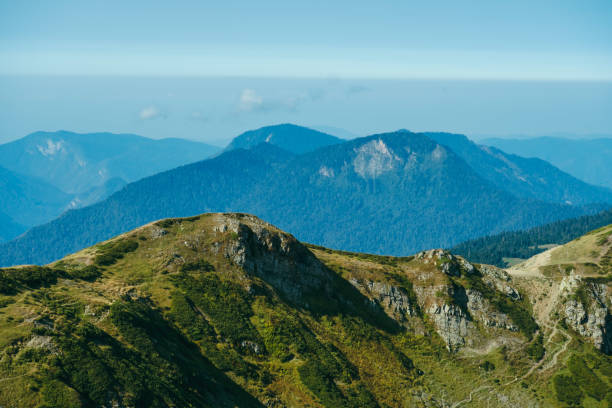 istock natural wallpaper landscape with high mountains against a blue sky 1276982631