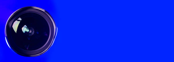 istock .Banner. The camera lens with blue backlight. Optics.. 1276983293