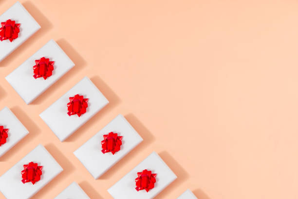 istock Christmas Gift Box in a Row on Pink Background 1276986272