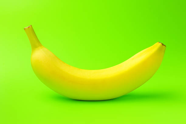 istock banana on a green background close-up. isolate 1276990004