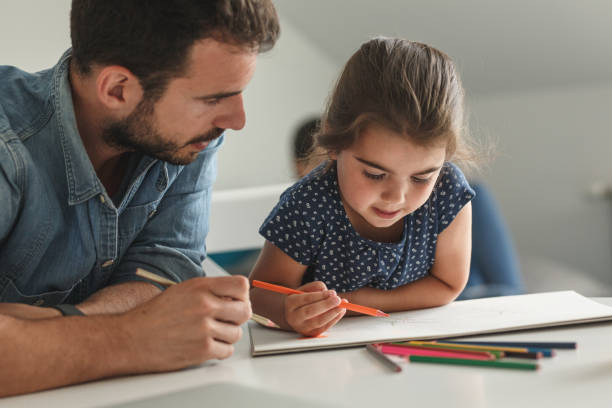 istock Father teach his daughter to draw. 1276991504