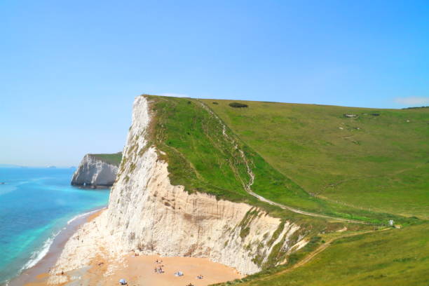 istock Durdle Door Cliff Lookout, Dorset on a sunny day 1276993843