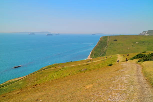 istock Durdle Door Cliff Lookout, Dorset on a sunny day 1276993853