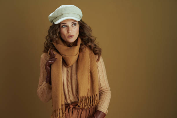 istock surprised woman looking at copy space on beige background 1276995617
