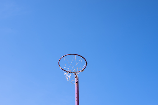 Netball hoop against sky background