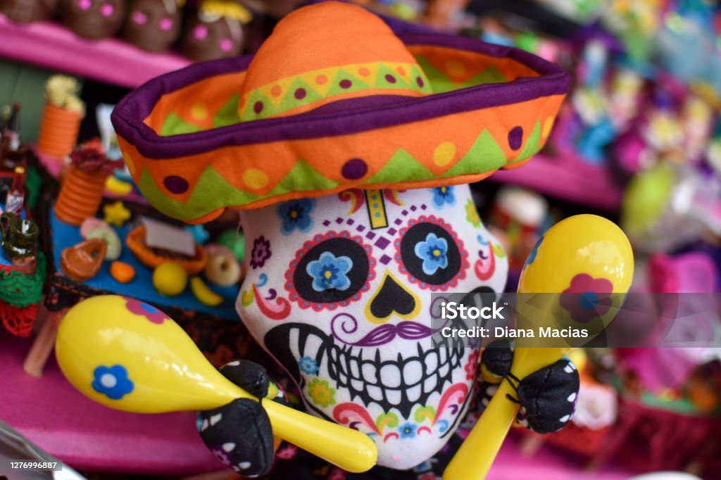 Colorful Mexican skull with hat and maracas Mexican Culture Stock Photo