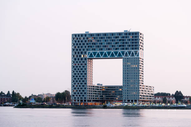 The Pontsteiger building on the south bank of the IJ waterway in Amsterdam, designed by Arons en Gelauff Architects and realised in 2019. The nickname of the apartment complex is the millionaire's building.