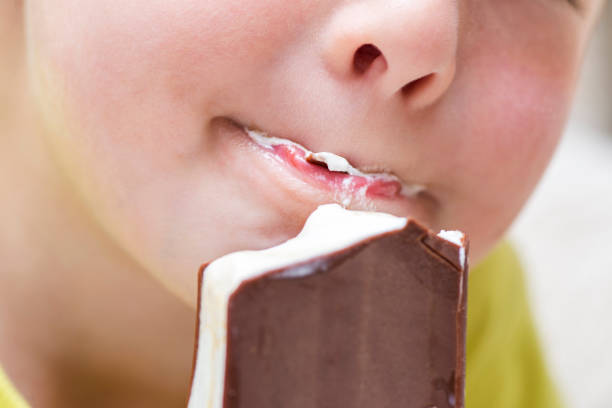 istock Happy little kid licking ice cream 1276999205