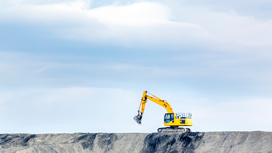 The big bulldozer and industrial pollution. Pollution is the introduction of contaminants into the natural environment that cause adverse change.