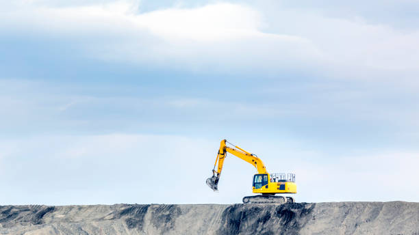 The big bulldozer and industrial pollution. Pollution is the introduction of contaminants into the natural environment that cause adverse change. The big bulldozer and industrial pollution. Pollution is the introduction of contaminants into the natural environment that cause adverse change. mining equipment stock pictures, royalty-free photos & images