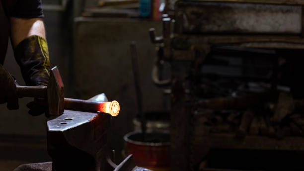 istock View of the blacksmith. A blacksmith is a metalsmith who creates objects from wrought iron or steel by forging the metal, using tools to hammer, bend, and cut. 1277004729